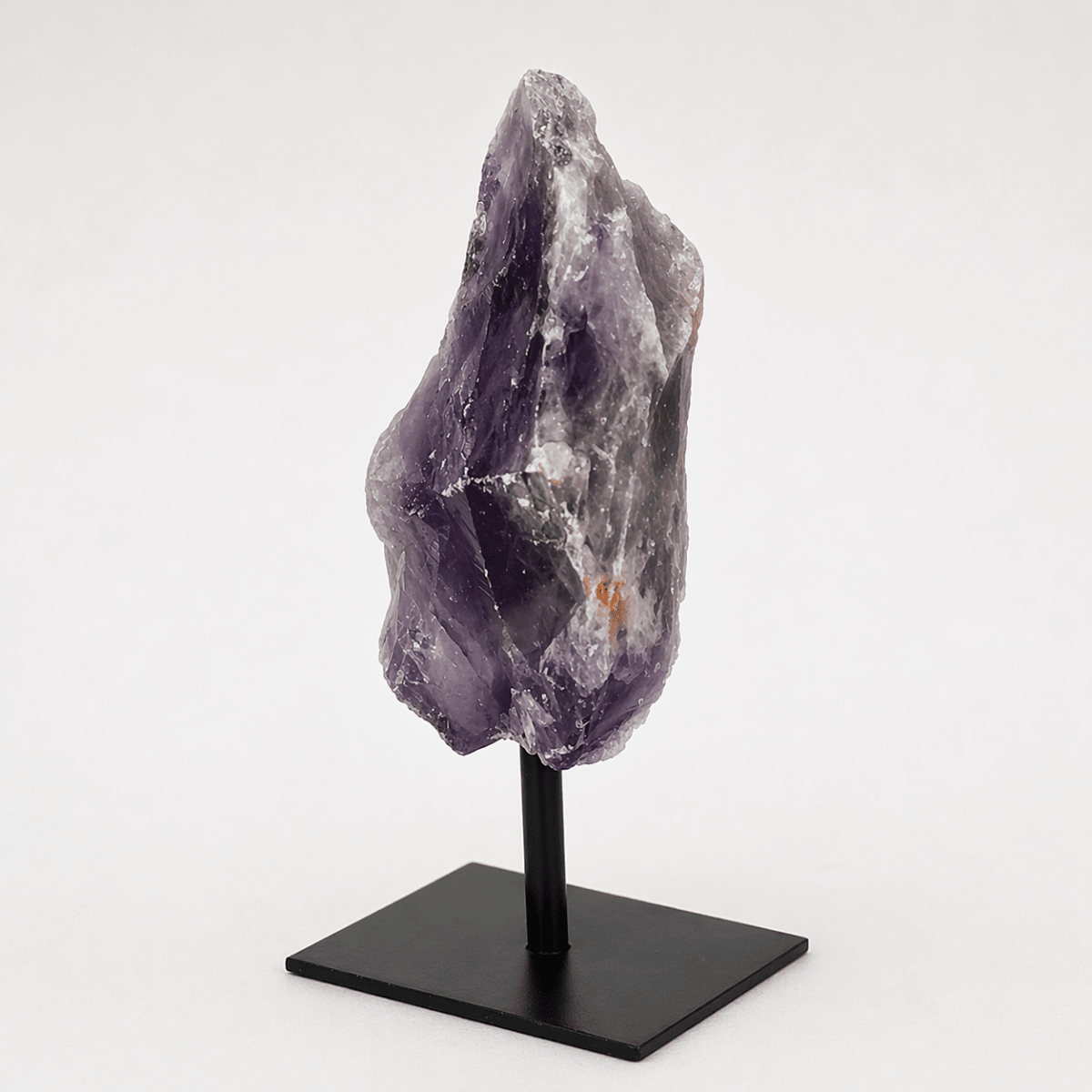 Regal Rebel 22 presents The Rough Amethyst on Metal Stand
