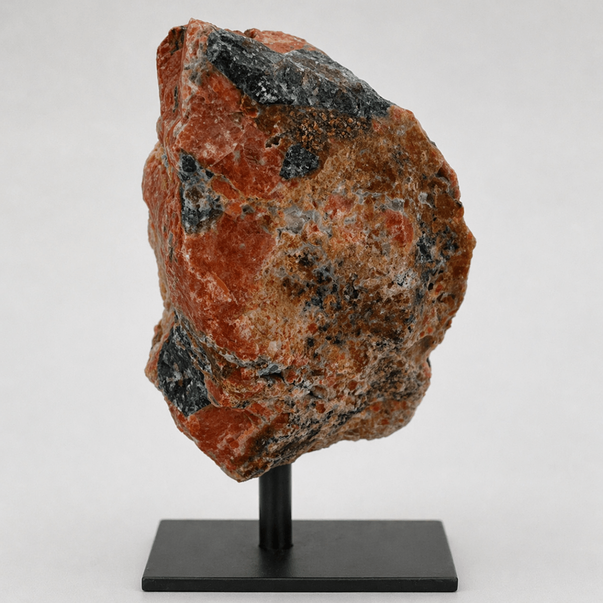 Regal Rebel 22 presents The Rough Apatite on Calcite Matrix on Metal Stand