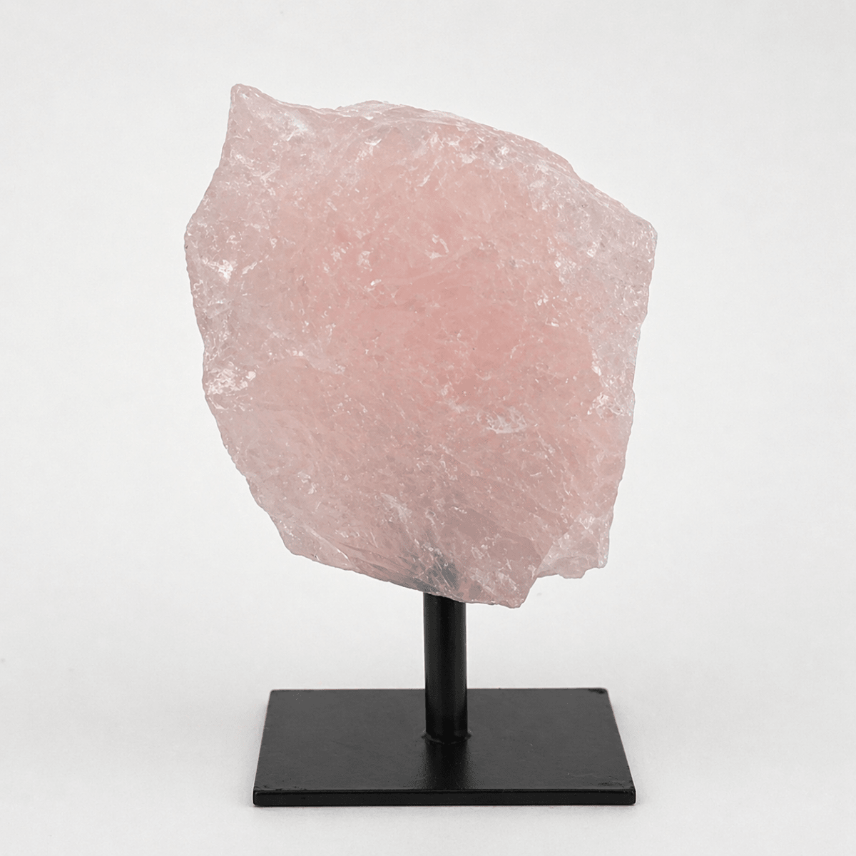 Regal Rebel 22 presents The Rough Rose Quartz on Metal Stand